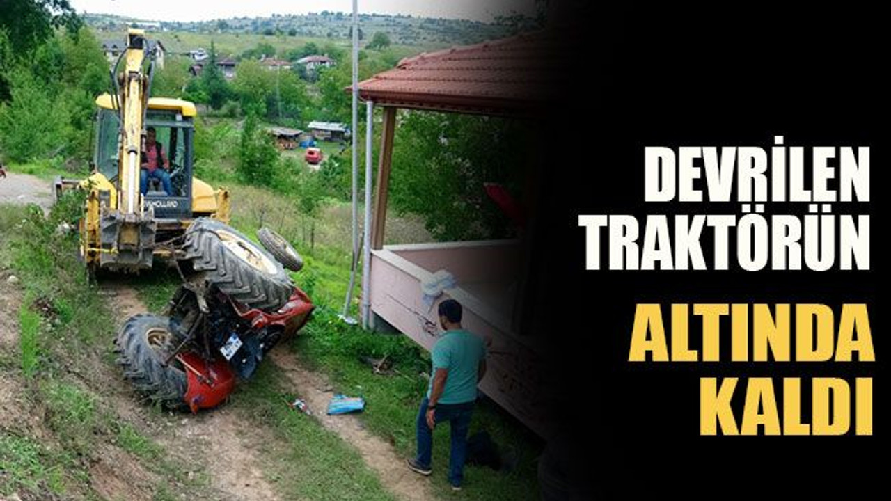 Devrilen traktörün altında kaldı