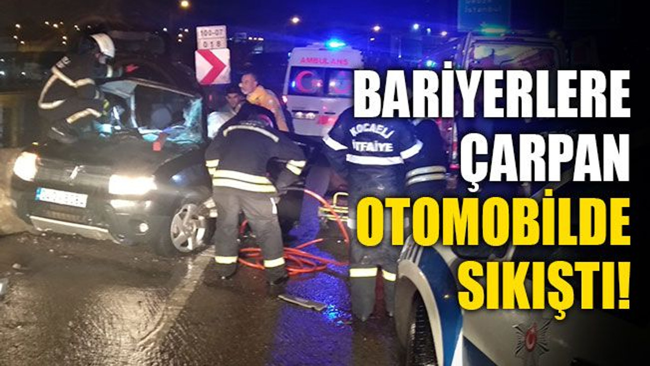 Bariyerlere çarpan otomobilde sıkıştı!