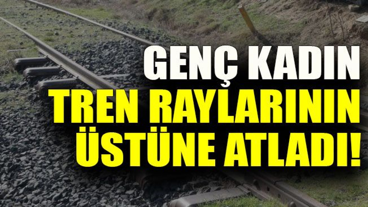 Genç kadın tren raylarının üstüne atladı!