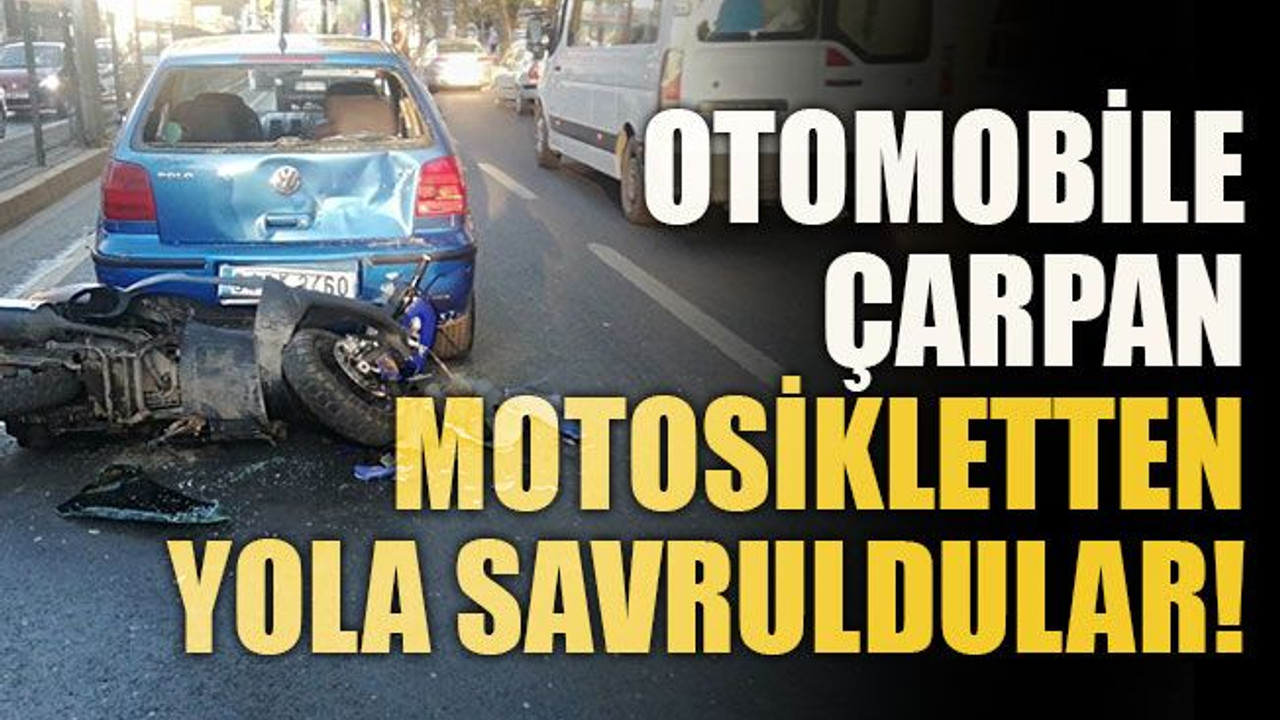 Otomobile çarpan motosikletten yola savruldular!