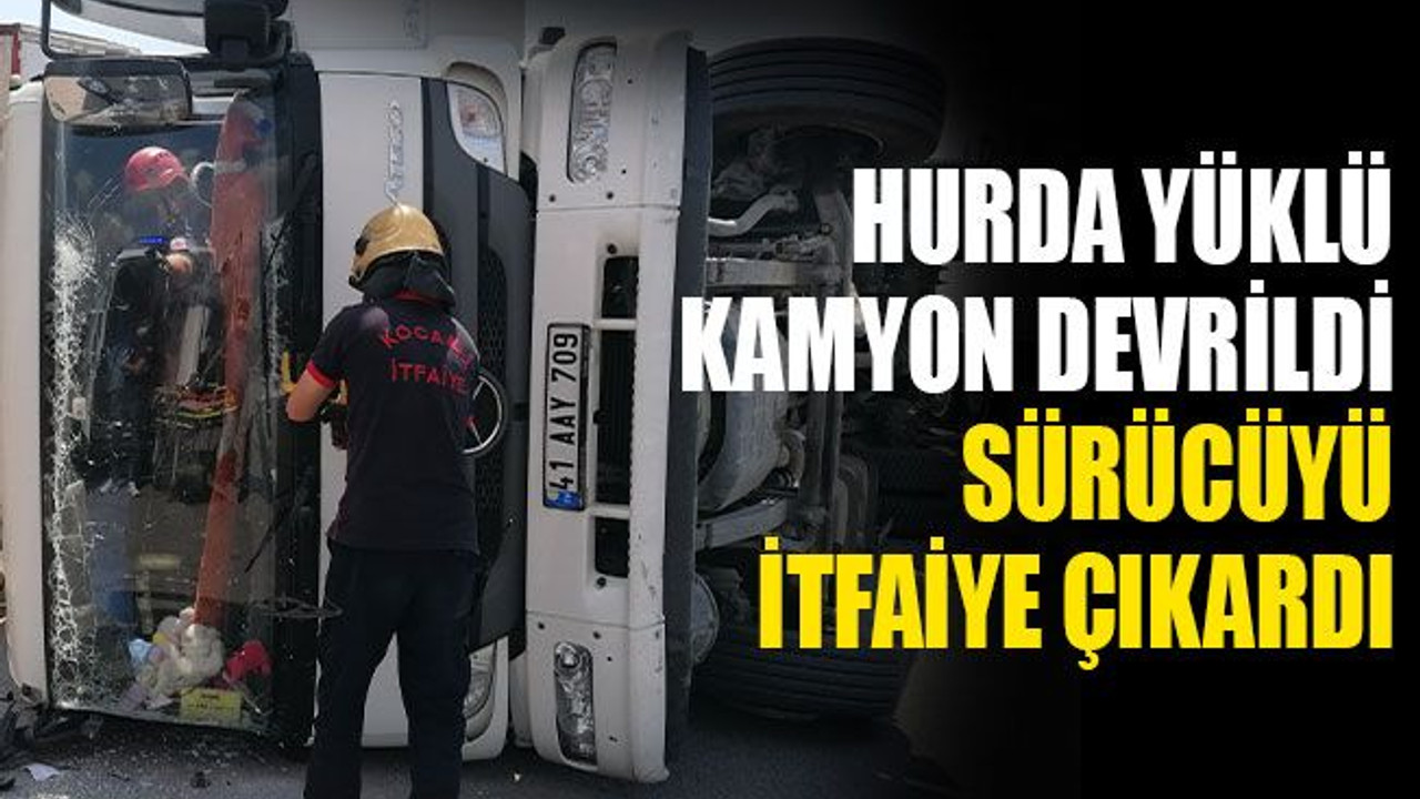 Hurda yüklü kamyon devrildi, sürücüyü itfaiye çıkardı