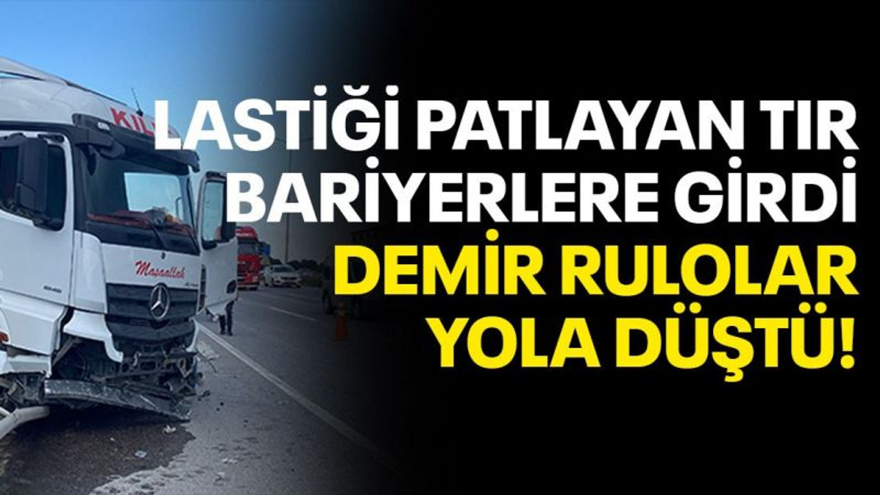 Lastiği patlayan tır bariyere çarptı, demir rulolar yola düştü