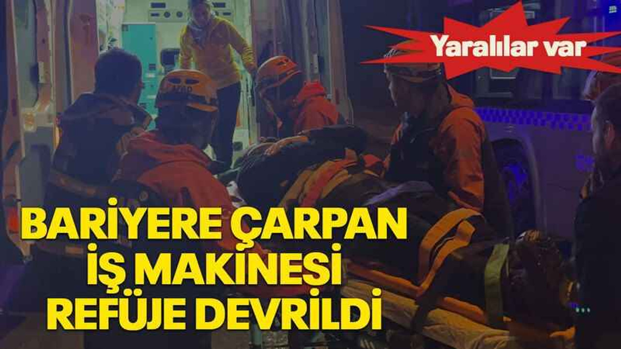 Bariyere çarpan iş makinesi refüje devrildi
