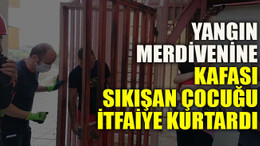 Yangın merdivenine kafası sıkışan çocuğu itfaiye kurtardı