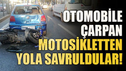 Otomobile çarpan motosikletten yola savruldular!