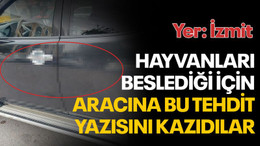 Hayvanları besledi diye, kazıyarak aracına tehdit yazısı yazdılar