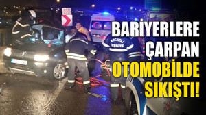 Bariyerlere çarpan otomobilde sıkıştı!
