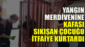 Yangın merdivenine kafası sıkışan çocuğu itfaiye kurtardı
