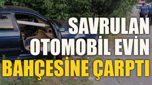 Savrulan otomobil evin bahçesine çarptı