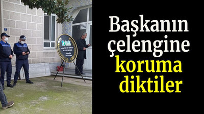 Başkanın çelengine koruma diktiler