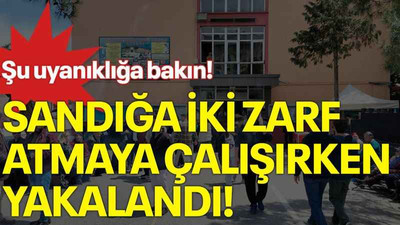 Şu uyanıklığa bakın! Sandığa iki zarf atmaya çalışırken yakalandı!