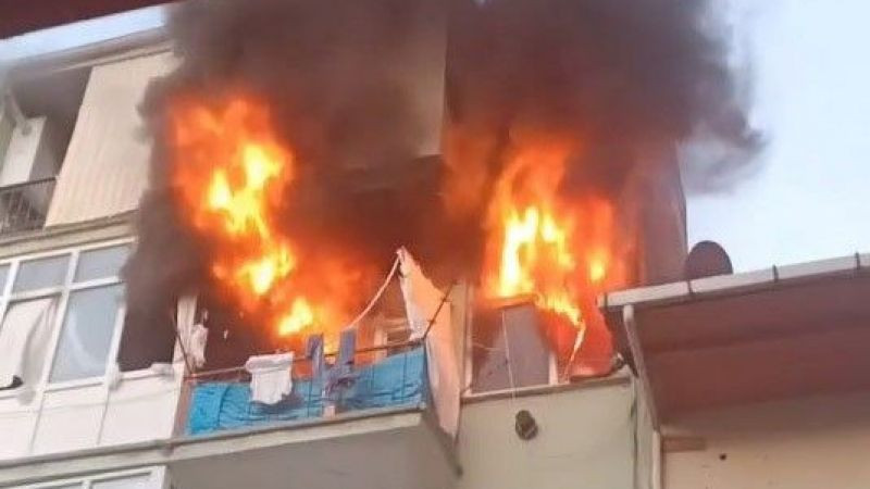 Alev alev yanan evden camı kırarak kurtuldu